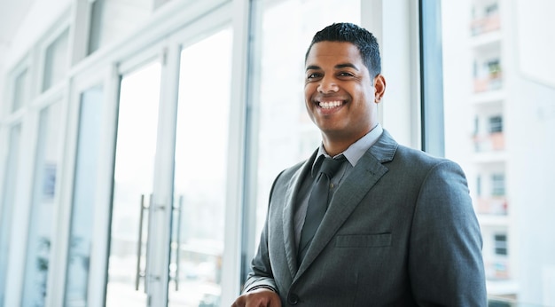 Nothing makes a statement like a stylish suit portrait of a confident young businessman working in a modern office