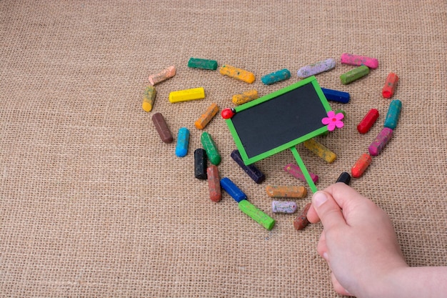 Notice board in the middle of crayon heart