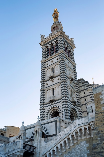 Notre Dame in Marseille on a sunny day, bright blue sky.