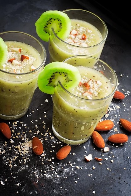 Nourishing green smoothie with fruit almond and oat bran
