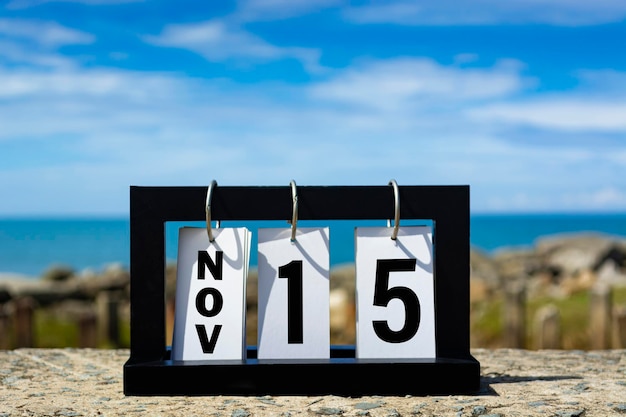 Premium Photo Nov 15 calendar date text on wooden frame with blurred Premium Photo Nov 15 calendar date text on wooden frame with blurred