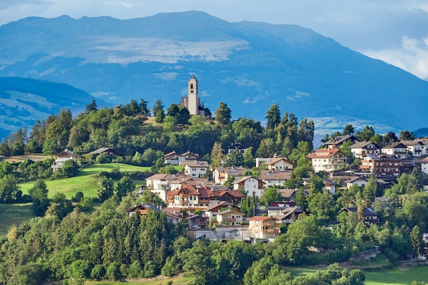 Nova Levante village with mountains