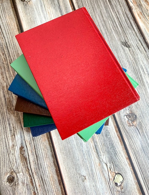 novels stack on wooden floor