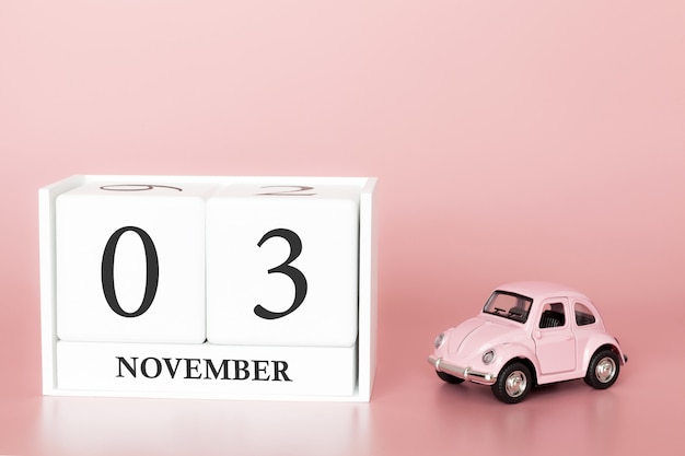 November 03rd. Day 3 of month. Calendar cube with car