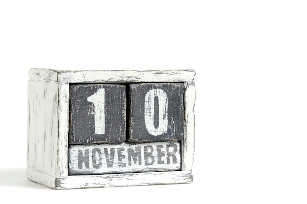 Photo november 10 on wooden calendar on white background