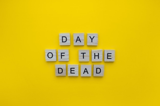 Photo november 1st and 2nd the day of the dead a minimalistic banner with the inscription in wooden letters on an orange background