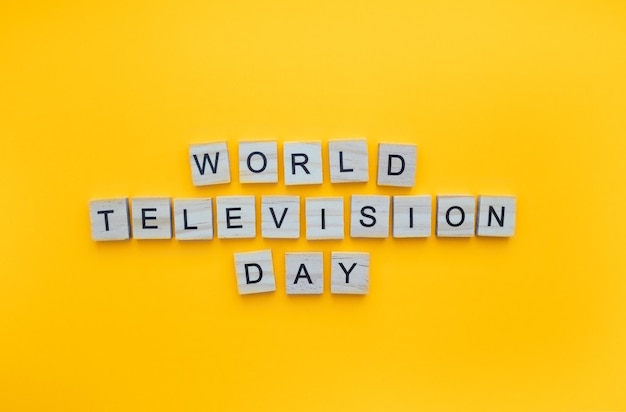 November 21 World Television Day minimalistic banner with the inscription in wooden letters