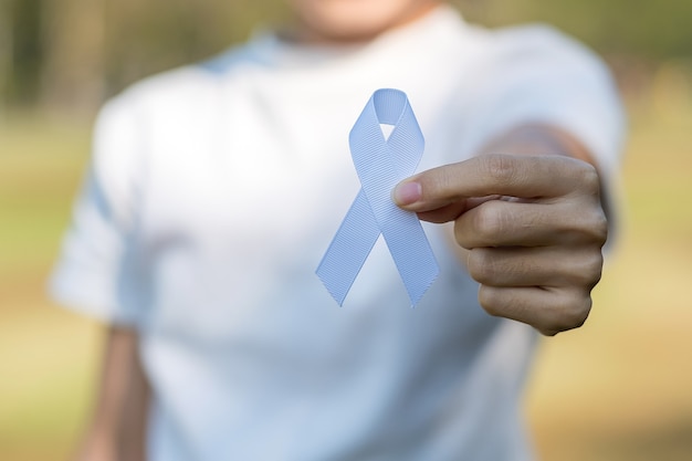 November Lung Cancer Awareness month, democracy and international peace day. Woman holding white Ribbon