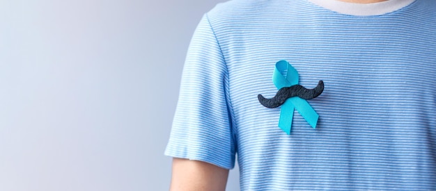 November Prostate Cancer Awareness month Blue Ribbon with mustache for supporting people living and illness Healthcare International men Father and World cancer day concept