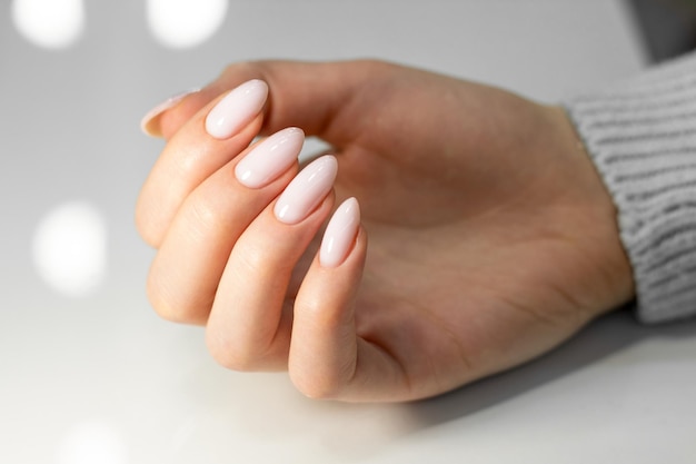 Nude manicure almond nails
