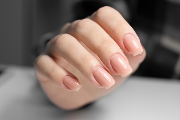 Nude manicure beige gel nail polish square shaped nails