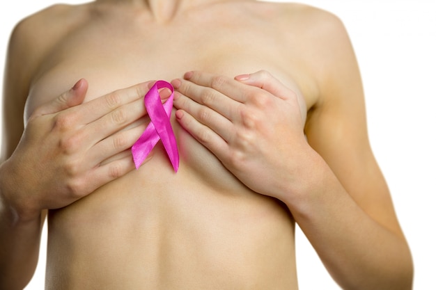 Photo nude woman with breast cancer ribbon