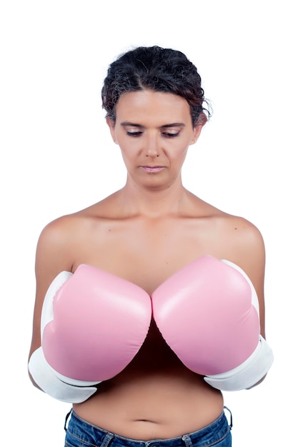 Nude young woman with pink boxing gloves, depicting a fight against breast cancer awareness.