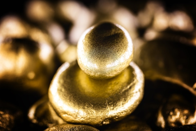 Nugget of gold, stone of value, golden texture. Crude gold mined. Concept of wealth and financial stability.