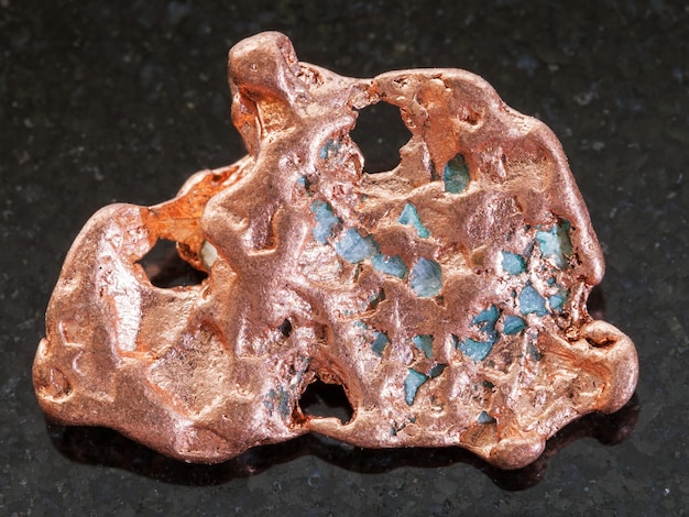 Nugget of Native copper stone on dark background