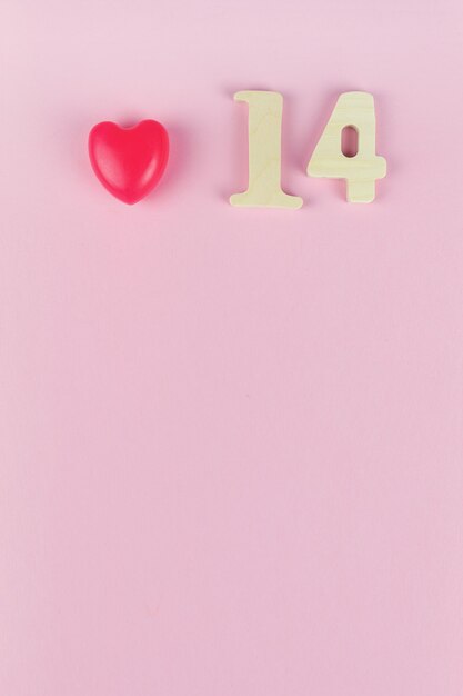 Number 14 Against Pink Wall. Valentine's day concept. Date 14 February.