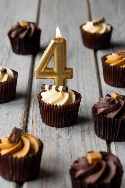 Number 4 celebration birthday cupcakes on a wooden background