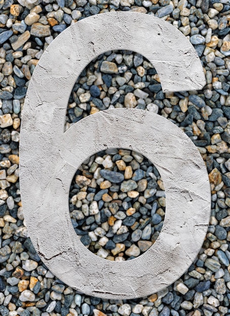 Number 6 with concrete texture on stones background