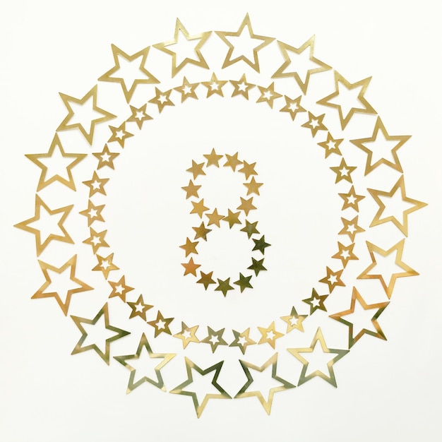 Number 8 Retro poster with golden number and stars around on white background Greeting card for your celebration concept