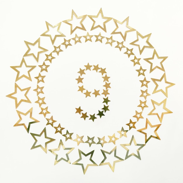 Photo number 9 retro poster with golden number and stars around on white background greeting card for your celebration concept