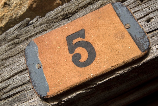 Number Five on Wood with Diagonal Tilt