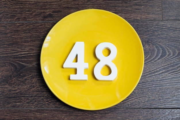 Number forty eight on the yellow plate