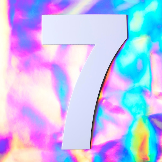 Number seven on the holographic textured background