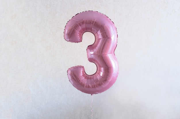 Number three. 3. pink balloon with number three for the girl's birthday. home party