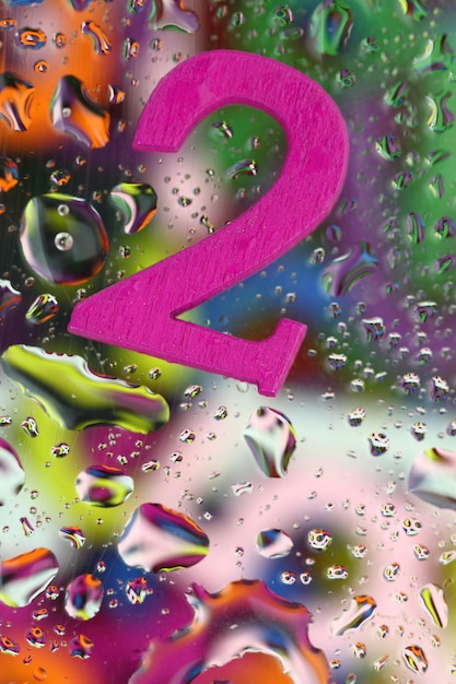 Number two on abstract colorful drops background