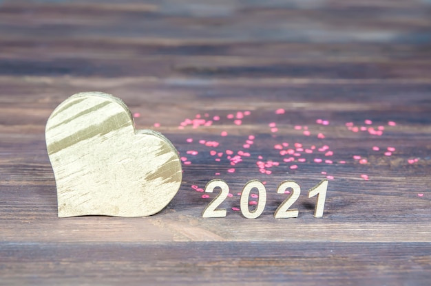 Numbers 2021 and a heart made of wood