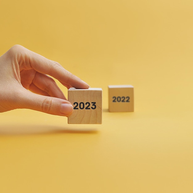 The numbers 2023 on wooden cubes Coming soon in 2023