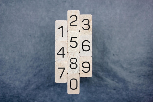 Numbers on wooden blocks from 0 to 9 Numbers inscription concept