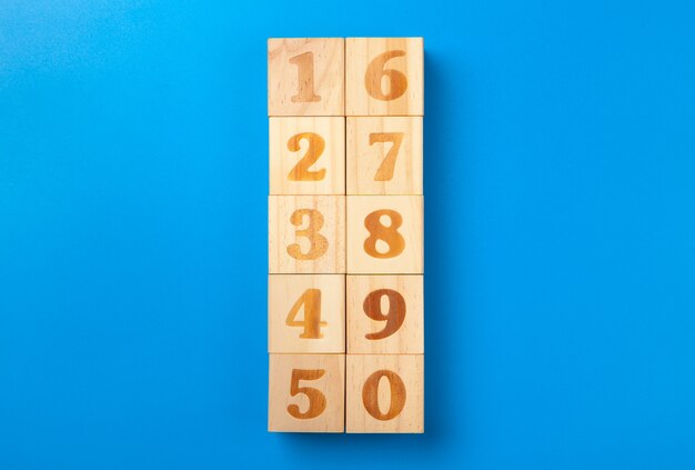 Numbers. Wooden colorful  blocks on blue