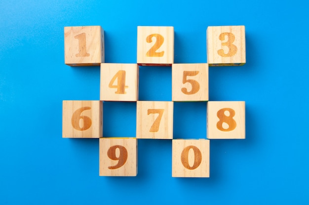 Numbers. Wooden colorful  blocks on blue 