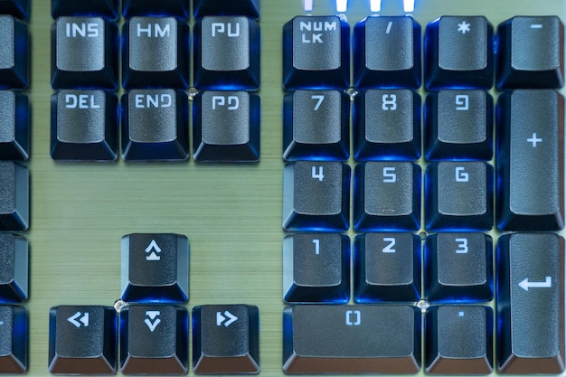 Numeric keypad black keyboard with blue backlight close-up