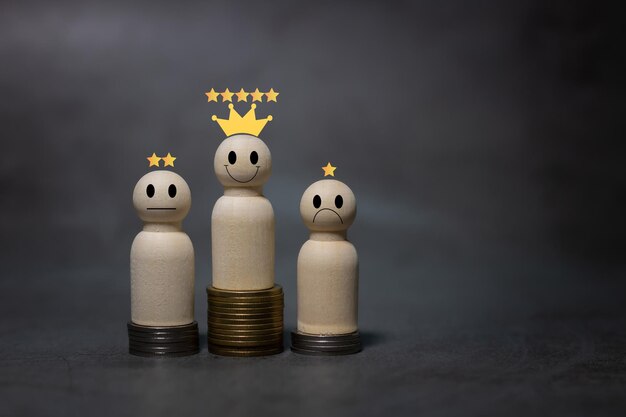 Numerous coins are stacked in a graph with wooden figurines Up and down arrow of businessman