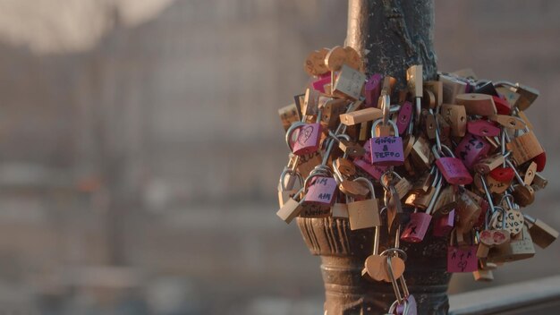 Numerous padlocks lock on the fence on the bridge