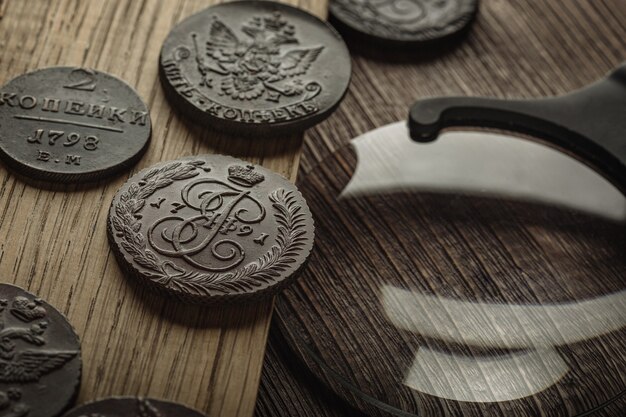 Numismatics. Old collectible coins on a wooden table.