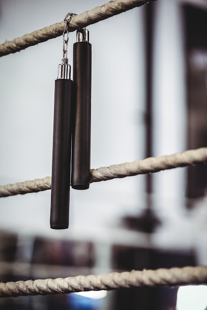 Photo nunchaku hanging off the ring