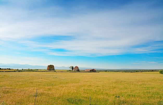 Nuraghe and church in the sardinian countryside