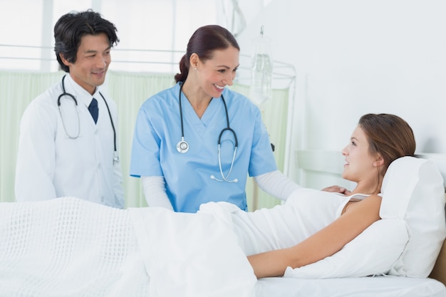 Nurse and doctor checking patient