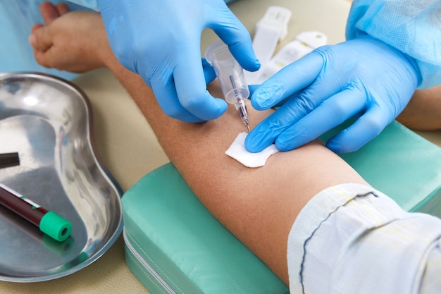 Nurse doing blood test from vein. Covid testing concept