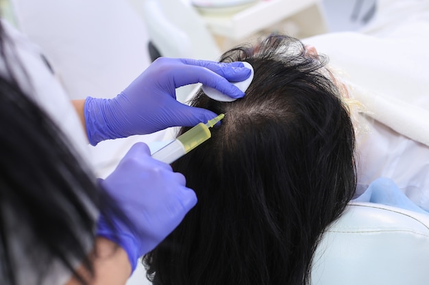 Nurse doing plasma injection