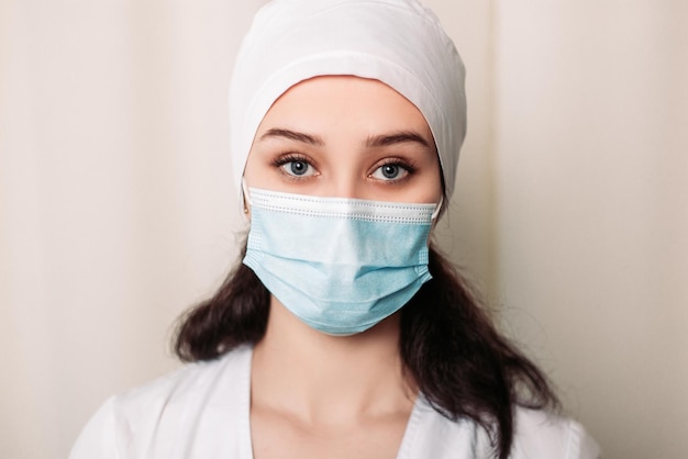 Nurse dressed in medical gown and wear face mask