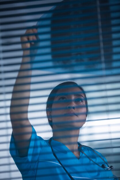 Nurse examining x-ray report