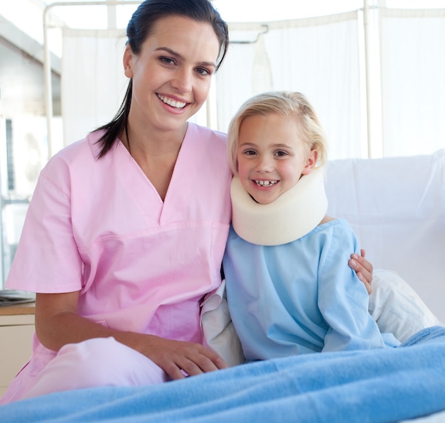 A nurse and her patient smiling at the camera 