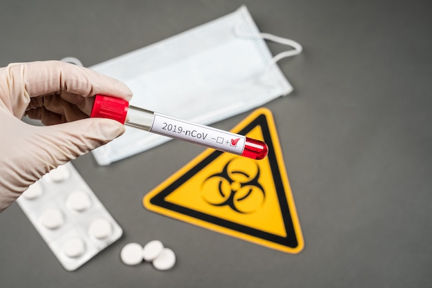 Nurse holding a positive blood test result for the new rapidly spreading Coronavirus, originating in Wuhan, China