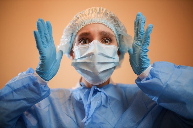 The nurse is in shockThe nurse holds his hands behind his headThe doctor is in shock Coronavirus