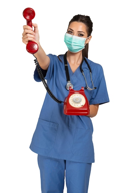 Nurse making a phone call with a vintage telephone covid and coronavirus concept Isolated on white background