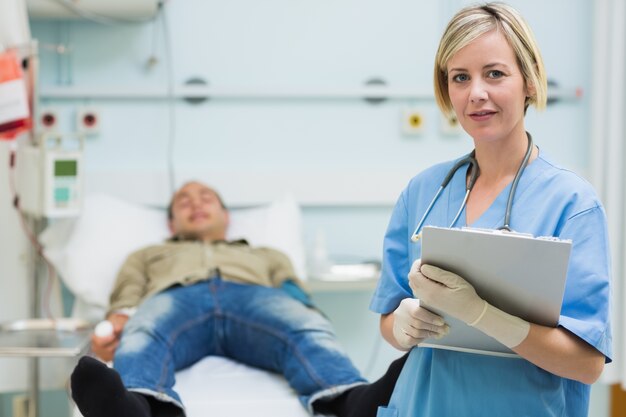 Nurse next to a male patient